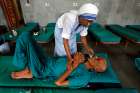 A member of the Missionaries of Charity tends to a patient in 2016 in Kolkata, India. Indian officials are seeking to freeze bank accounts of the Missionaries of Charity following the July 5 arrest of a nun on child trafficking charges. 