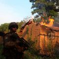 A French soldier patrols near a house on fire Jan. 3 at a village in Bossangoa, Central African Republic. The nation&#039;s Catholic bishops criticized media portrayals of their country&#039;s conflict as religious in nature and listed preconditions for restoring peace and effective governance.