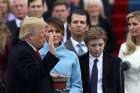 U.S. President Donald Trump places his hand on the Bible as he takes the oath of office administered by U.S. Chief Justice John Roberts Jan. 20.