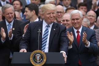 President Donald Trump gathers with Vice President Mike Pence and congressional Republicans at the White House in Washington May 4 after the House of Representatives approved a repeal of major parts of the Affordable Care Act and replace it with a Republican health care bill.
