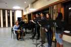 St. Jerome’s Universty choir practices before Sunday Mass.