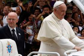 Domenico Giani, commander of the Vatican police force, keeps watch as Pope Francis arrives to celebrate Mass with bishops, priests and members of religious orders in the Cathedral of the Immaculate Conception in Manila, Philippines, in this Jan. 16, 2015 , file photo. Giani said that he is not aware of any plans to attack the Vatican or the Pope although Islamic State militants have made general threats.