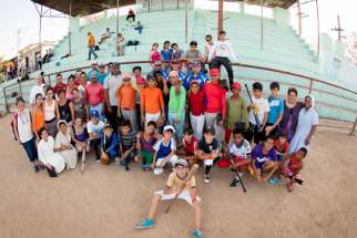 Participants and volunteers pose for a photo at the Holy Childhood Association baseball encounter in Cuba in late May. The camp was hosted by a team of professional baseball coaches and Catholic leaders from the Pontifical Mission Societies in the United States, which oversees the association.