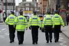 Police walk near along a London street Feb. 3, 2020, following the terror attack in the city believed to be orchestrated by Sudesh Amman, 20, who was shot dead by armed police following what police declared a terrorist-related incident.