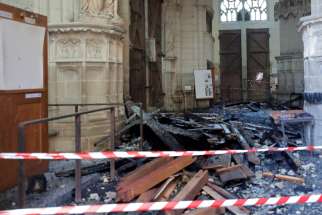Debris caused by a fire inside the Cathedral of Sts. Peter and Paul in Nantes, France, is seen July 19, 2020. French police have charged a cathedral volunteer with &quot;destruction and damage by fire&quot; in connection to the blaze.