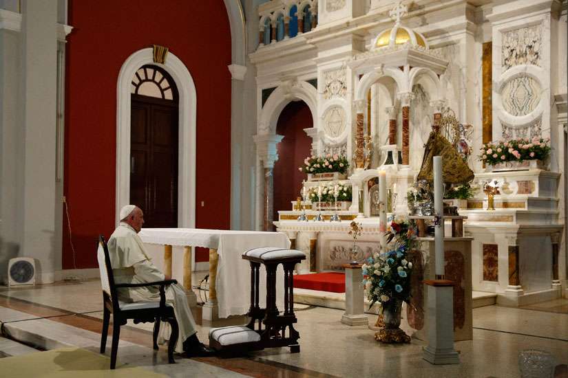 Pope Francis prays near the statue of Our Lady of Charity, patroness of Cuba, in the Minor Basilica of the Shrine of Our Lady of Charity in El Cobre, Cuba, Sept. 21.
