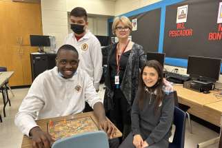 One of April 2023 Unsung Heroes, Ms. Lorrie Ragusa, Child &amp; Youth Worker at Dante Alighieri Academy Catholic Secondary School with her students.