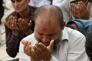 Pakistani Muslims pray during Ramadan in Karachi. Pakistan has seen more than 62 people killed since 1990 by mob violence.
