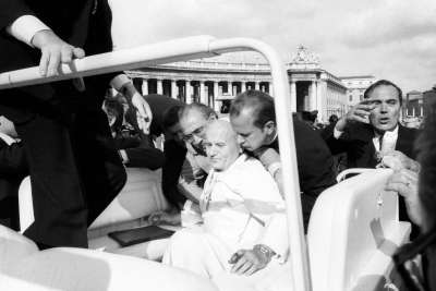 Pope John Paul II is assisted by aides after being shot in St. Peter’s Square May 13, 1981.  