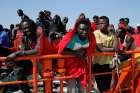 Migrants, intercepted aboard a makeshift boat in the Mediterranean Sea, are seen after arriving on a rescue boat July 22 at the Spanish port of Algeciras. 