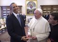 U.S. President Obama shares laugh with Pope Francis as he receives copy of Francis&#039; apostolic exhortation at the Vatican on March 27. 