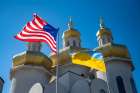 U.S. and Ukrainian national flags fly in solidarity outside St. Michael the Archangel Ukrainian Catholic Church in Baltimore Feb. 27, 2022.