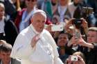 Pope Francis greets the crowd during his general audience in St. Peter&#039;s Square at the Vatican May 3.