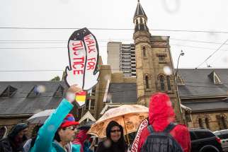 Indigenous Canadians call for the acknowledgement of their suffering at a Toronto march in 2015.