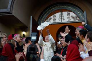 Pope Francis releases a dove after a meeting with Chaldean Catholics at the Church of St. Simon the Tanner in Tbilisi, Georgia, Sept. 30.