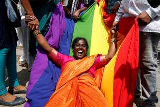 A LGBT supporter in Bengaluru, India, celebrates Sept. 6 after the country&#039;s Supreme Court decriminalized homosexual acts between consenting adults. 