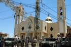 Lebanese army soldiers stand on an armored truck next to a church during a patrol after bombings in late June in Qaa. When a series of bombs exploded in the Lebanese Christian village near the Syrian border, it not only changed the lives of the victims and their families, but also the lives of Syrian refugees living nearby.