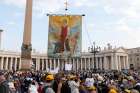 A man holds a banner showing new St. Nunzio Sulprizio during the canonization Mass for seven new saints celebrated by Pope Francis in St. Peter&#039;s Square at the Vatican Oct. 14. Among the new saints were St. Paul VI and St. Oscar Romero. 