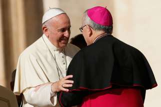 Pope Francis talks with Archbishop Charles J. Chaput of Philadelphia during his general audience in St. Peter&#039;s Square at the Vatican Nov. 19. The Pope confirmed Nov. 17 that he will attend the World Meeting of Families in Philadelphia in September.