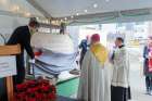 Paul Brown (left), society chair of Providence Health Care, and Peter Bull (right), vice-chair of Providence’s board, unveil the new cornerstone for Vancouver’s St. Pau’s Hospital Dec. 6 with Vancouver Archbishop J. Michael Miller.