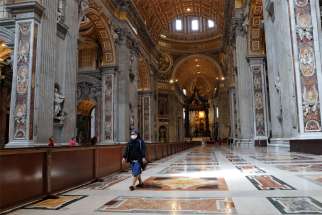 A nun walks in St. Peter&#039;s Basilica at the Vatican May 18, 2020, after the basilica reopened to the public during the COVID-19 pandemic.