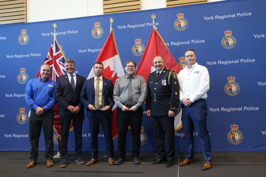 Nick Galatianos, centre, receives the 2023 Community Partner Award from Crime Stoppers of York Region.