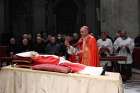 Cardinal Mauro Gambetti, archpriest of St. Peter&#039;s Basilica, sprinkles holy water on the body of Pope Benedict XVI during a Rite of Reception after the transfer of the body into St. Peter&#039;s Basilica in the early morning at the Vatican Jan. 2, 2023.