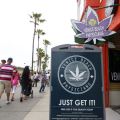 People walk past a medical marijuana shop in Santa Monica, Calif., June 23. Legal in California since 1996, such marijuana outlets, along with doctor&#039;s consultation centers and smoking paraphernalia shops, l marijuana outlets have proliferated along Sant a Monica&#039;s Venice Beach boardwalk.