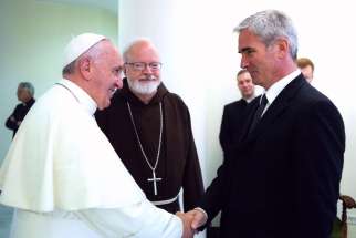 Pope Francis shakes hands with a clerical abuse survivor at the Vatican on July 7, 2014. The Pope said that there is no place in ministry for those who abuse minors, in a written letter dated Feb 2, to bishops and religious orders.