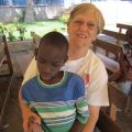 Sr. Rosemary Fry with with Limbe, a deaf boy with autism in Haiti.