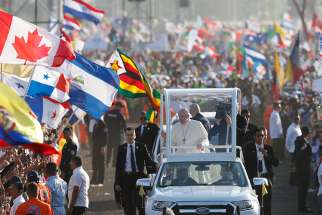 Pope Francis greets the crowd before celebrating Mass for World Youth Day pilgrims at St. John Paul II Field in Panama City Jan. 27, 2019. 