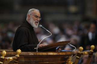 Capuchin Franciscan Father Raniero Cantalamessa, preacher of the papal household, gives the homily during the Good Friday service led by Pope Francis in St. Peter&#039;s Basilica at the Vatican April 14.