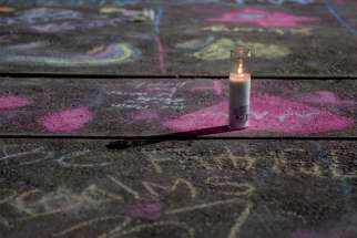Messages written in sidewalk chalk are seen at the University of Texas of the Permian Basinas Sept. 2, 2019, following an Aug. 31mass shooting in Odessa, Texas.