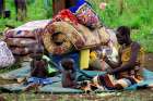 A family from South Sudan eats at a camp for displaced people in Lamwo, Uganda. As civilians are increasingly targeted in South Sudan&#039;s civil war, a bishop urged prominent community leaders speak out. (