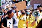 Brooklyn Albuquerque is behind the megaphone as she leads a Black Lives Ontario rally.