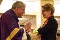 Toronto&#039;s Cardinal Thomas Collins blesses Ontario Premier Kathleen Wynne at the first-ever Roman Catholic Mass celebrated at Queen’s Park in Toronto.