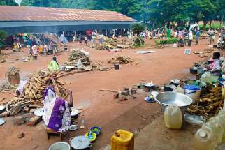 Displaced people are seen on the grounds of a seminary Aug. 9 in Bangassou, Central African Republic. Catholic priests whose villages have been attacked have taken to Facebook to express outrage and appeal for help.
