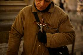 A man holds a crucifix at the cathedral in Santiago, Chile, May 18, 2018. Bishop Celestino Aos Braco of Copiapo, Chile, said April 4 in Rome that the Catholic Church in Chile must do everything possible to repair the damage caused by clergy sexual abuse and subsequent cover-up, and accept the decision of the courts investigating cases.