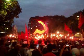 On the day he was killed, Paez had facilitated the release of an organizer of a farmers’ group arrested by the army in March. Torches and the golden sickle are said to symbolize the productive force of the Philippine society, according to the protesting group.