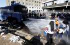 Italian police use a water cannon Aug. 24 as they clash with protesting refugees who had been forcibly removed from a building where they had been living in Rome. 