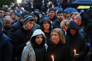 People mourn the loss of life as they hold a vigil for the victims of the Tree of Life Synagogue shooting in Pittsburgh Oct. 27. Pope Francis at his Sunday Angelus prayed for those affected by the attack inside the Pittsburgh synagogue. 