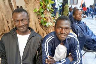 African migrants gather at the Caritas diocesan center in Palmero, Sicily, June 1.