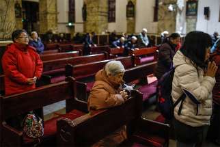Chinese Catholics pray in late January in the Cathedral of the Immaculate Conception in Beijing. 