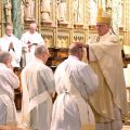 Ottawa Archbishop Terrence Prendergast lays hands on Fr. Jim Tilley of Oshawa, Ont., one of four men ordained to serve as priests in the Anglican Ordinariate. 