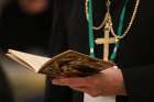 A bishop prays on the first day of the annual general assembly of the USCCB in Baltimore June 11, 2019. 