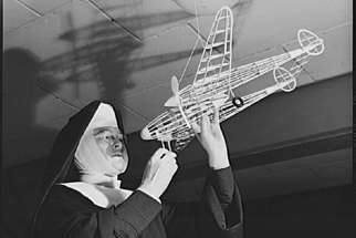 Sr. Mary Aquinas checks out a model airplane. The nun earned many honours and accolades during her life for her work in both education and aeronautics.  