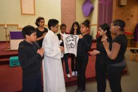 St. Sylvester Catholic School students perform their rendition of Three Trees lead by lead actor John Porathur, Grade 7, who played Jesus Christ.