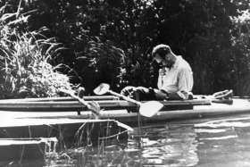 Father Karol Wojtyla, the future Pope John Paul II, is pictured reading in a kayak in this photo dated 1955. Less than six months after St. John Paul II was canonized, questions are being raised about a book of lectures he penned on social ethics as a yo ung priest in his Polish homeland.