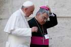 In this 2015 file photo, Pope Francis and Italian Bishop Marcello Semeraro of Albano leave the opening session of the Synod of Bishops on the family at the Vatican. 