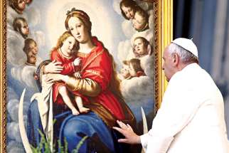 Pope Francis blesses a painting depicting the Virgin Mary with baby Jesus in St. Peter’s Square at the Vatican